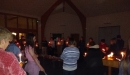 Prayer and singing with the Christingles lit